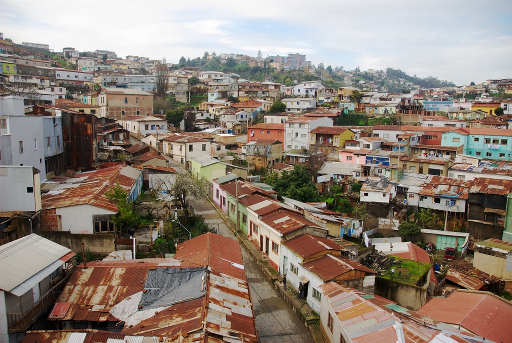 A dense cluster of colorful houses on a hillside.