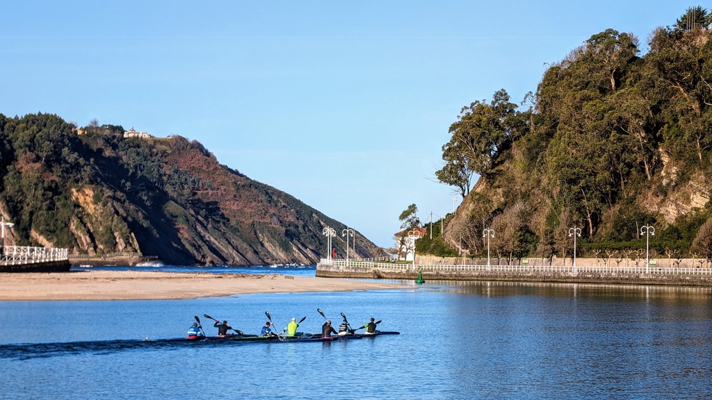 A group of kayakers paddling on a calm river