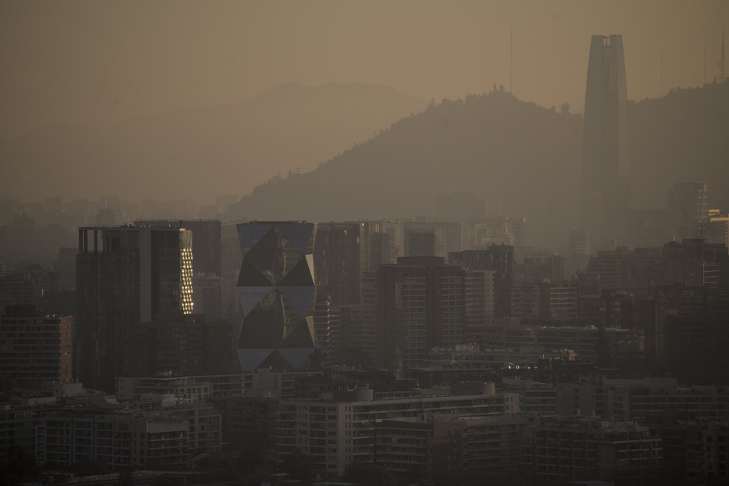 A hazy, city skyline seen through a heavy layer of smog.