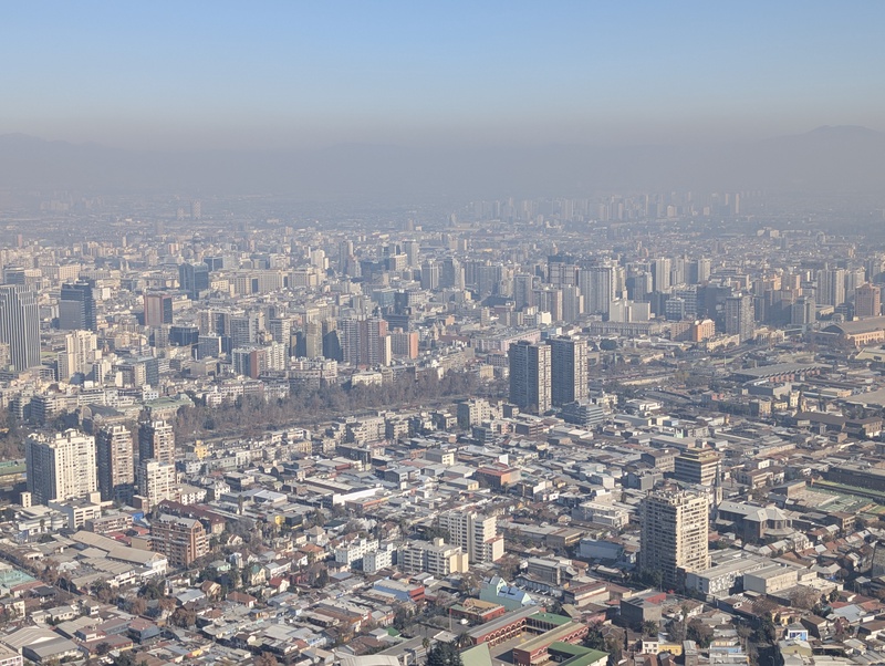 An expansive view of a hazy, urban landscape.