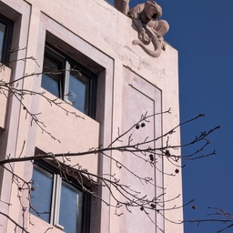 An architectural sculpture on top of a building.