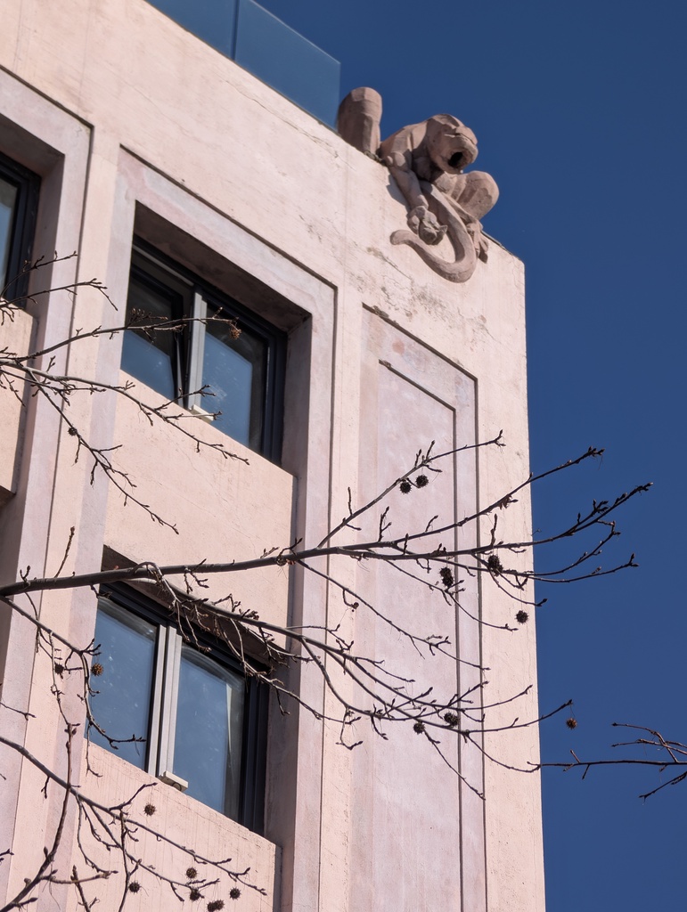 An architectural sculpture on top of a building.