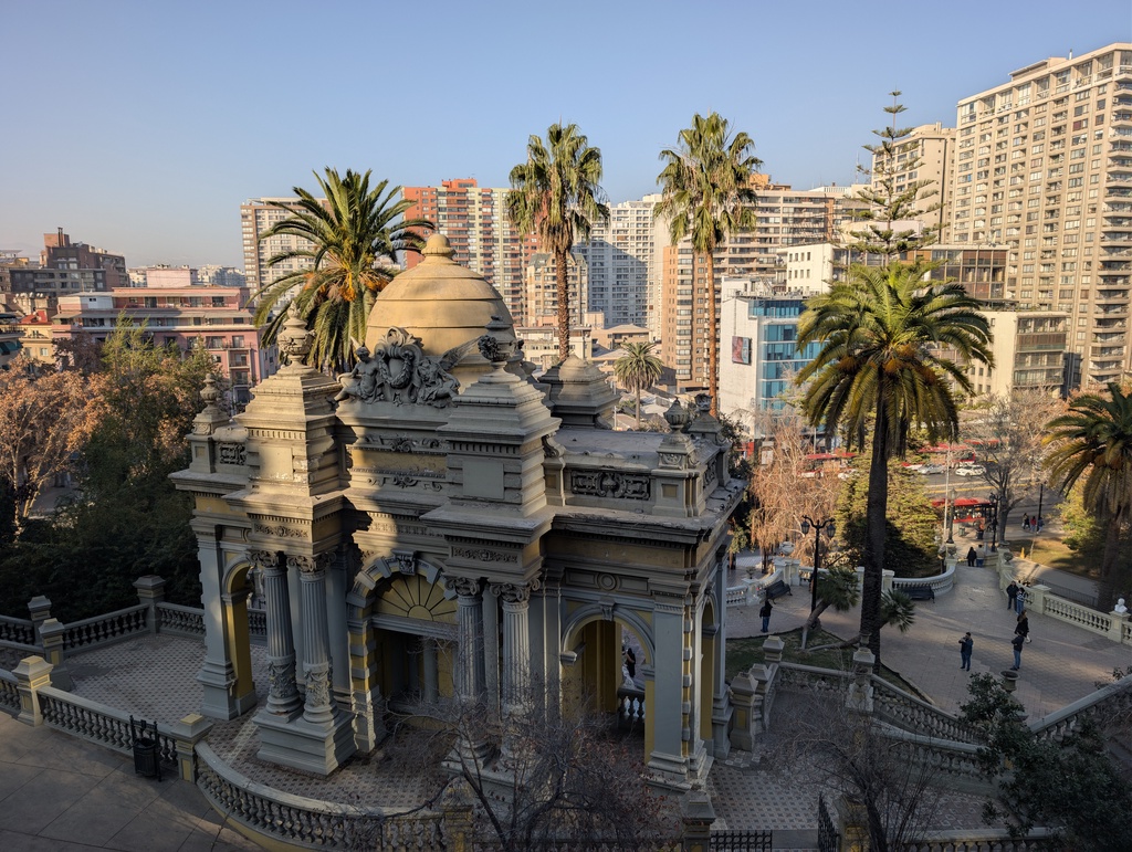 An ornate, classical-style pavilion in an urban park setting.