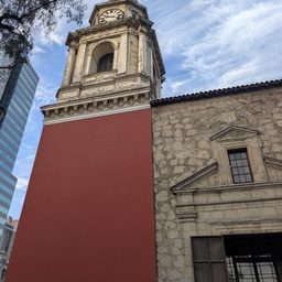 An old clock tower in a city square.