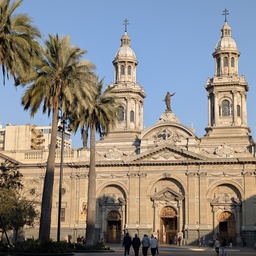 A large, ornate cathedral in a city square.