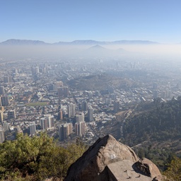 An expansive city view overlooking a hazy, urban landscape.