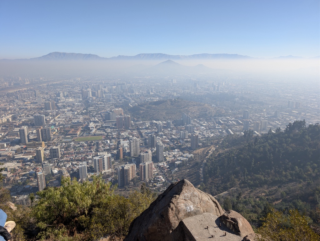 An expansive city view overlooking a hazy, urban landscape.