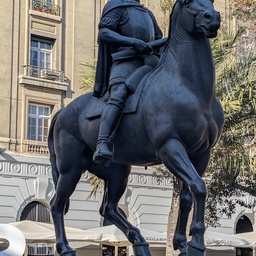 An equestrian statue of a man on a pedestal.