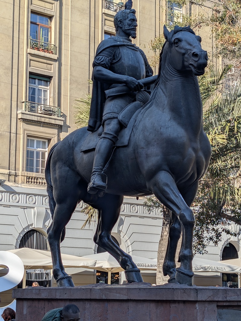 An equestrian statue of a man on a pedestal.