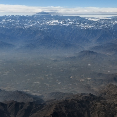 Snow-capped mountains under a blue sky.
