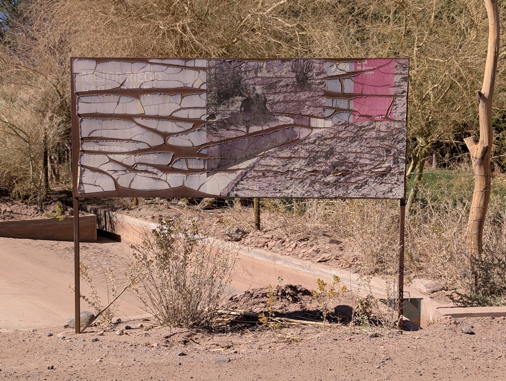 An informative signpost in a natural setting.
