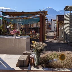 An outdoor patio area with a view of a snow-capped mountain peak in the distance.