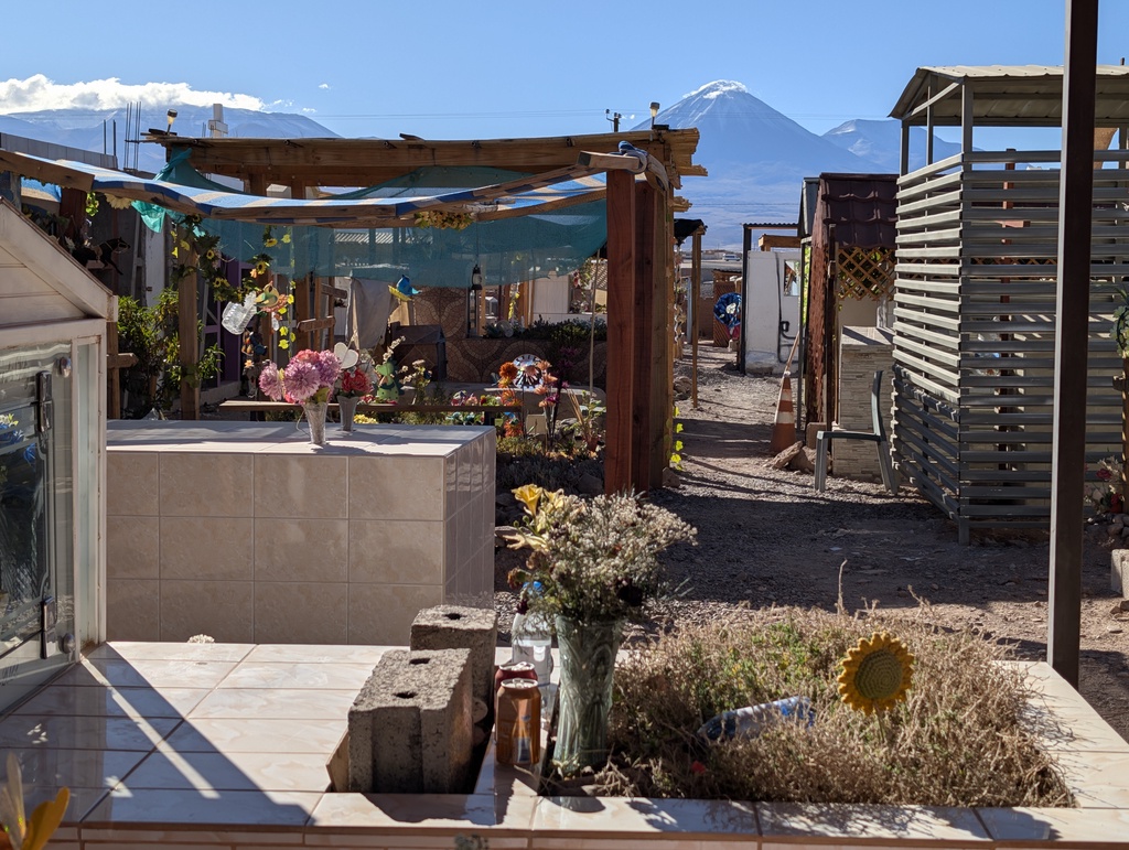An outdoor patio area with a view of a snow-capped mountain peak in the distance.